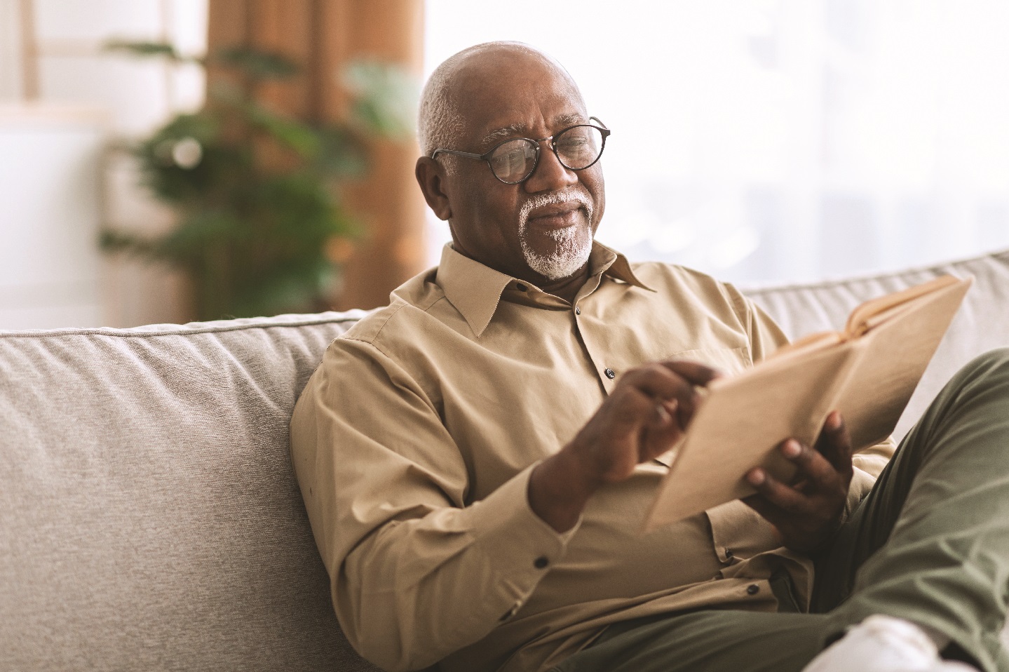 ELDERLY MAN READING