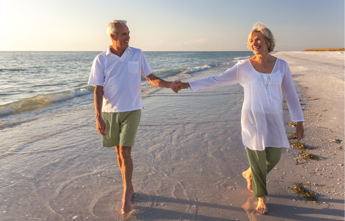 COUPLE ON THE BEACH WALKING