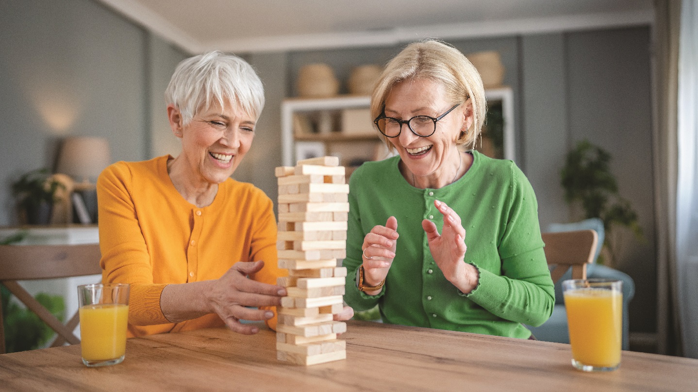 WOMEN PLAYING JENGA