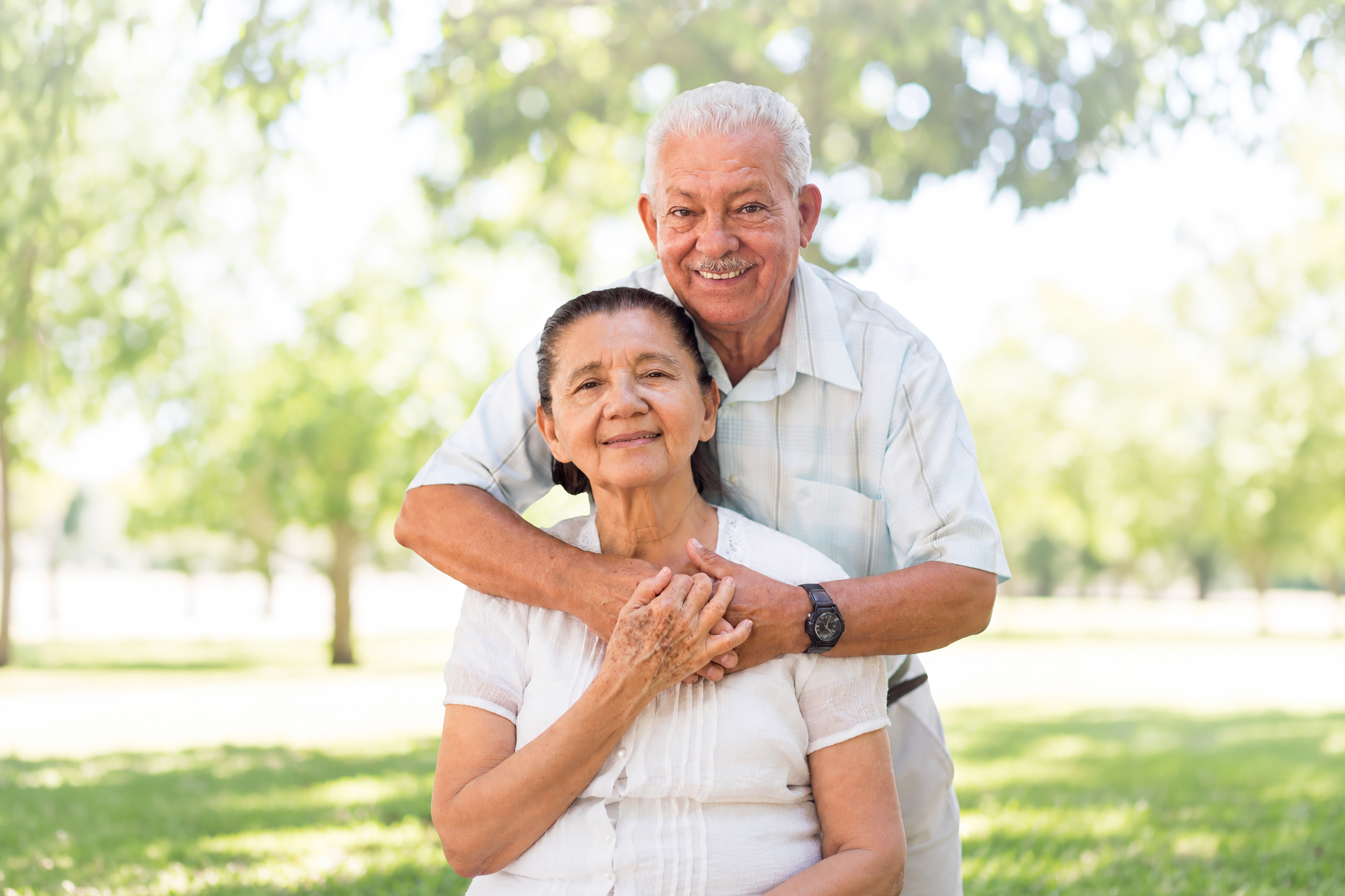 Older adult happily receiving assistance at home.